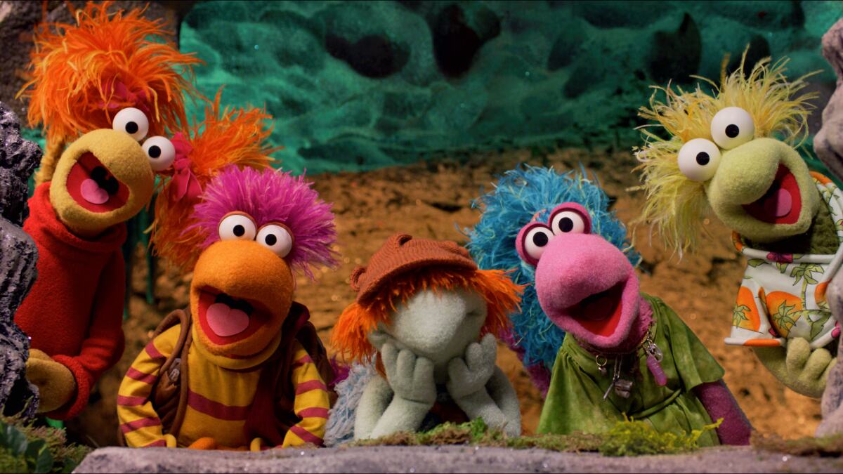 Five stringy-haired, googly-eyed, multicolored Muppets.