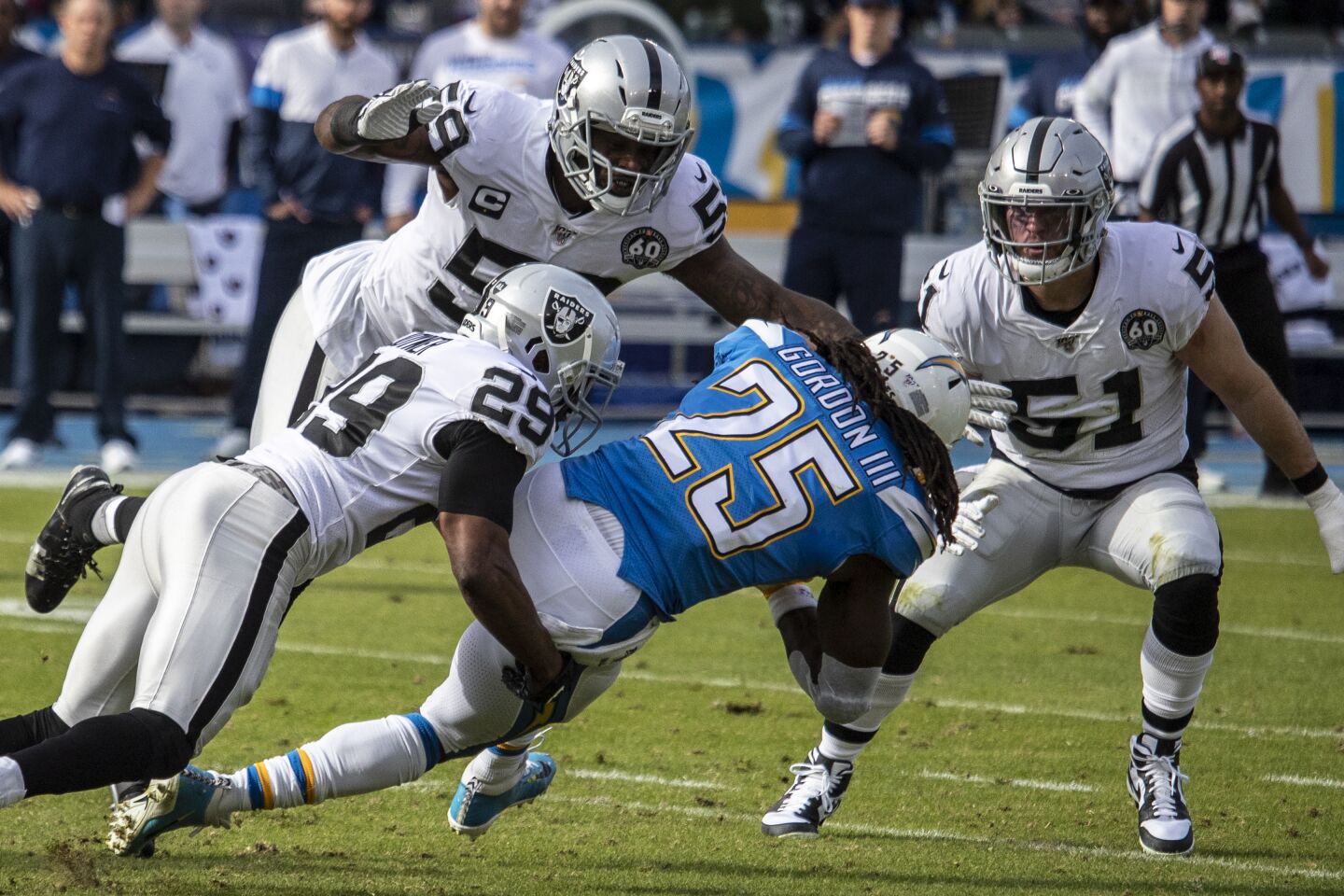 Chargers running back Melvin Gordon is brought down by Oakland Raiders free safety Lamarcus Joyner during the first quarter.