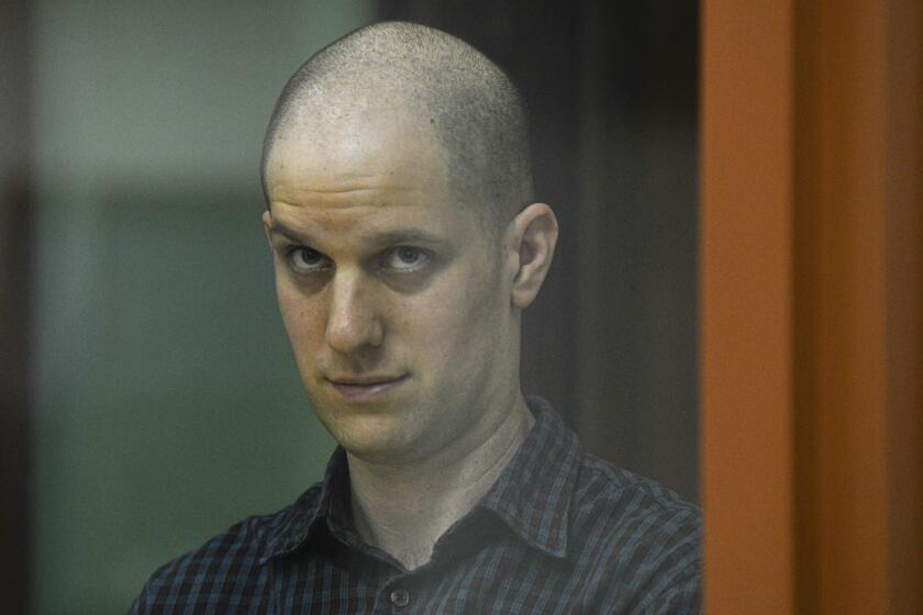 Wall Street Journal reporter Evan Gershkovich stands in a glass cage in a courtroom in Yekaterinburg, Russia, Wednesday, June 26, 2024. Fifteen months after he was arrested in the city of Yekaterinburg on espionage charges, Gershkovich returns there for his trial starting Wednesday behind closed doors. Gershkovich, his employer and the U.S. government deny the charges. (AP Photo)
