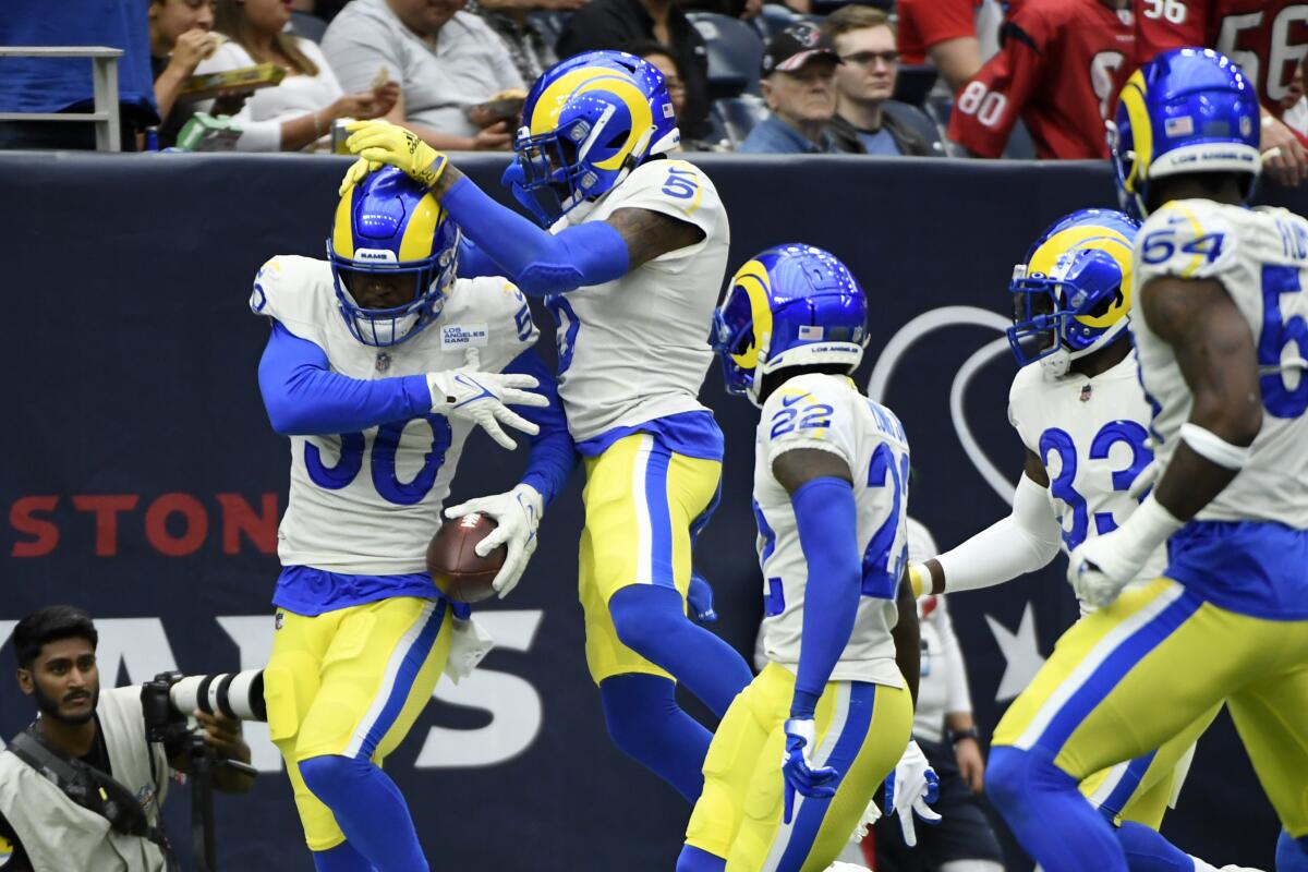 Rams linebacker Ernest Jones (50) celebrates his interception against the Texans.