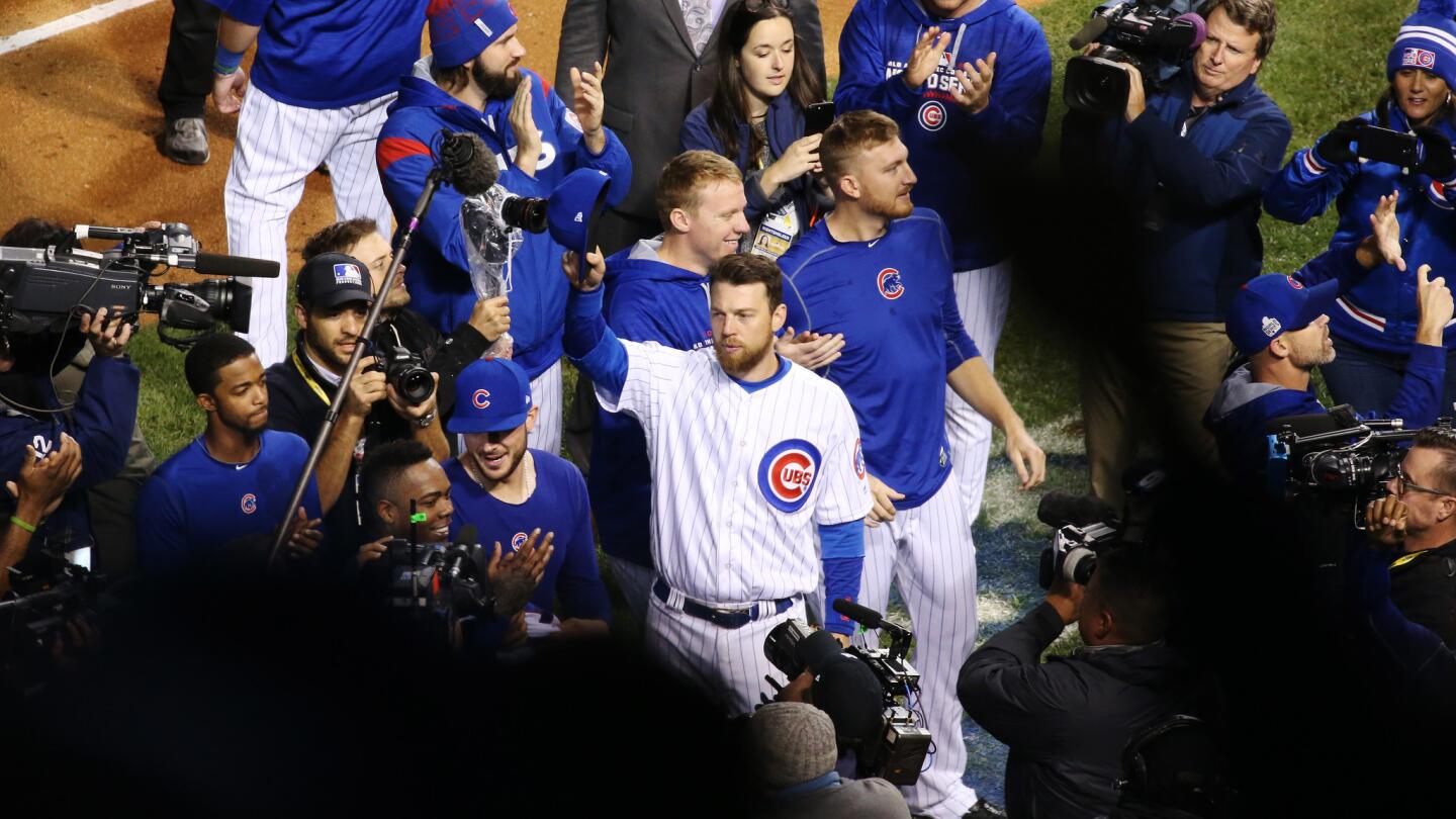 Chicago Cubs left fielder Ben Zobrist (18), center, and teammates acknowledge fans after a 3-2 Cubs win over the Cleveland Indians in Game 5 of the World Series at Wrigley Field Sunday, Oct. 30, 2016, in Chicago. (John J. Kim/Chicago Tribune)