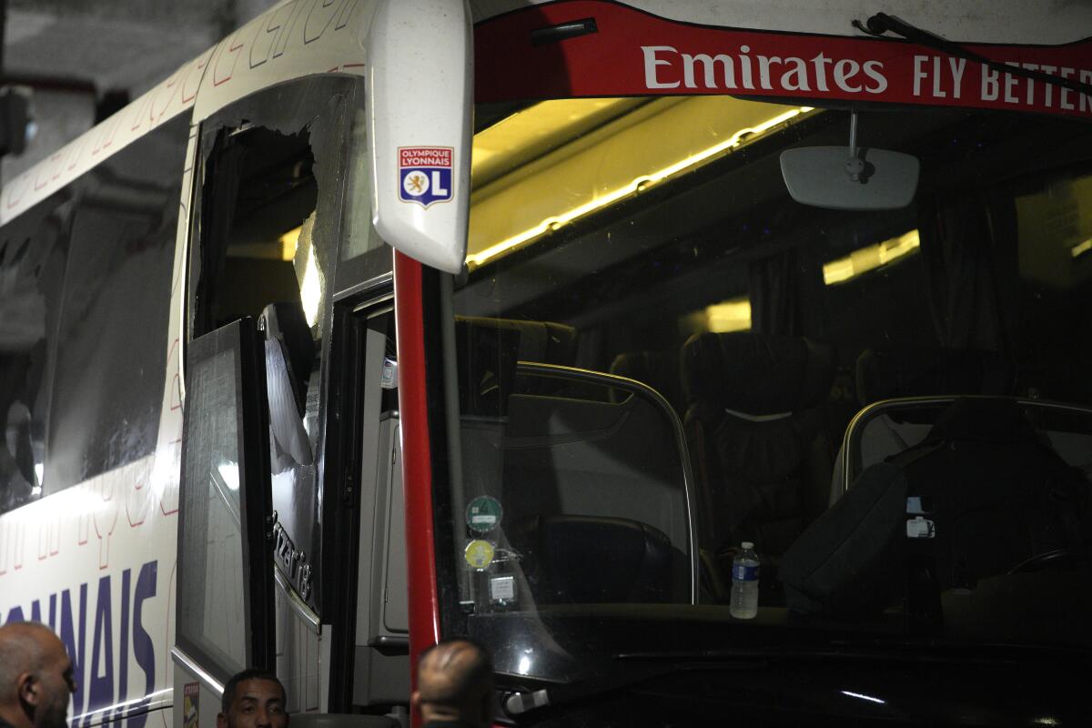 The bus of the Lyon soccer team is seen stoned before arriving at the Velodrome Stadium prior to the French League One soccer match between Olympique de Marseille and Lyon in Marseille, France, Sunday, Oct. 29, 2023. (AP Photo/Daniel Cole)