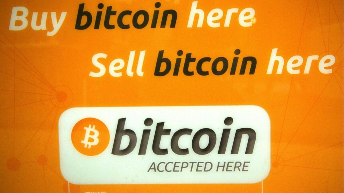 A sign is seen on a bitcoin machine in Sydney in May 2016.
