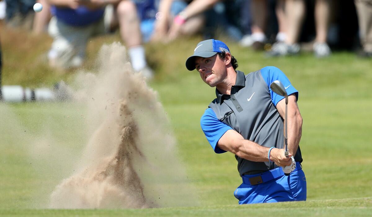 Rory McIlroy plays out of a bunker on the 16th hole during the first round of the British Open on Thursday at Royal Liverpool in Hoylake, England.