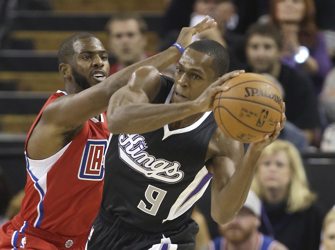 Clippers point guard Chris Paul pressures Kings point guard Rajon Rondo in the first half Wednesday night in Sacramento.