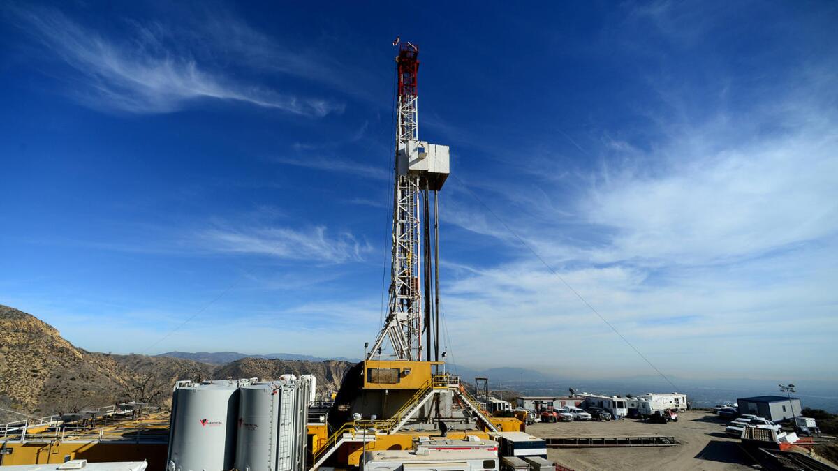 Crews work on a relief well at the Aliso Canyon facility above the Porter Ranch area of Los Angeles