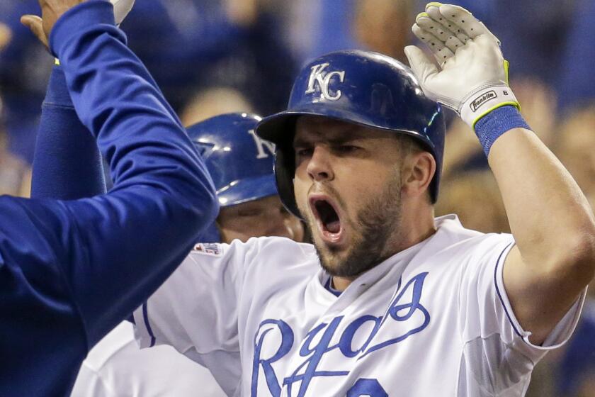 Kansas City Royals third baseman Mike Moustakas celebrates with his teammates after hitting a two-run home run in Game 3 of the American League Championship Series on Oct. 5.
