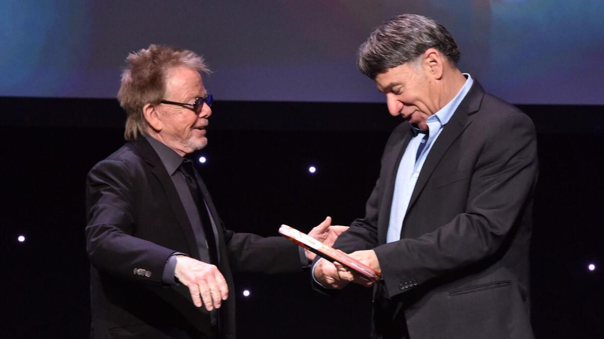 Honoree Stephen Schwartz, right, accepts the Founders Award from ASCAP President Paul Williams at the 2017 ASCAP Screen Music Awards on May 16, 2017, in Los Angeles.