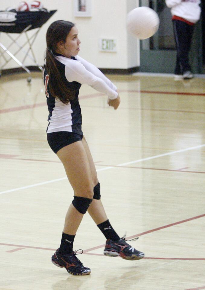 FSHA's Emily Develle hits the ball during a game against Chaminade at Flintridge Sacred Heart Academy in La Canada on Thursday, October 11, 2012.