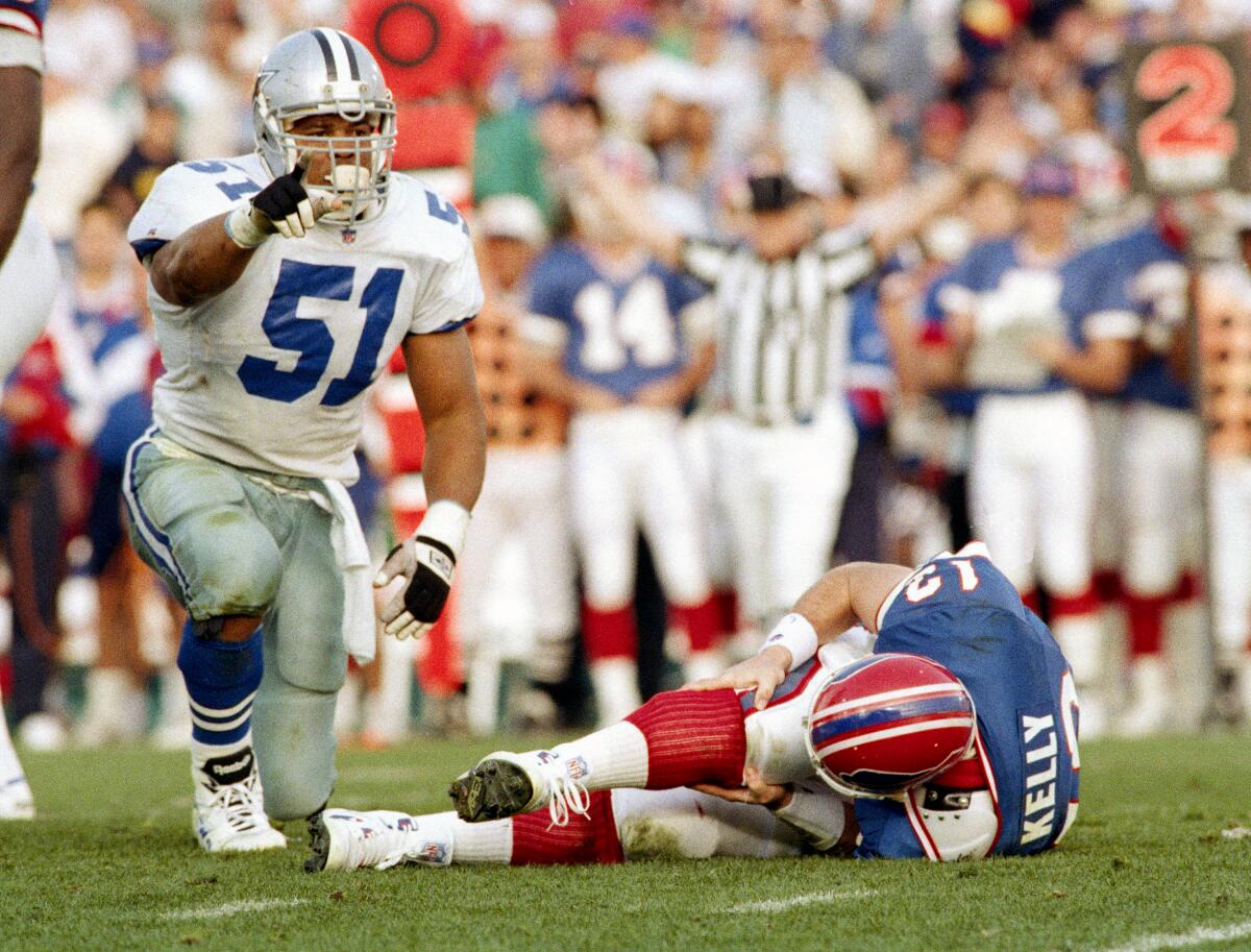 The Cowboys' Ken Norton Jr. reacts after bringing down Bills quarterback Jim Kelly in the Super Bowl on Jan. 31, 1993.
