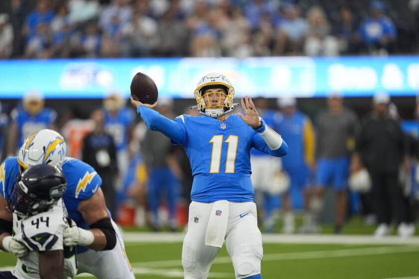 Chargers quarterback Luis Perez (11) passes against the Seattle Seahawks in their preseason game.