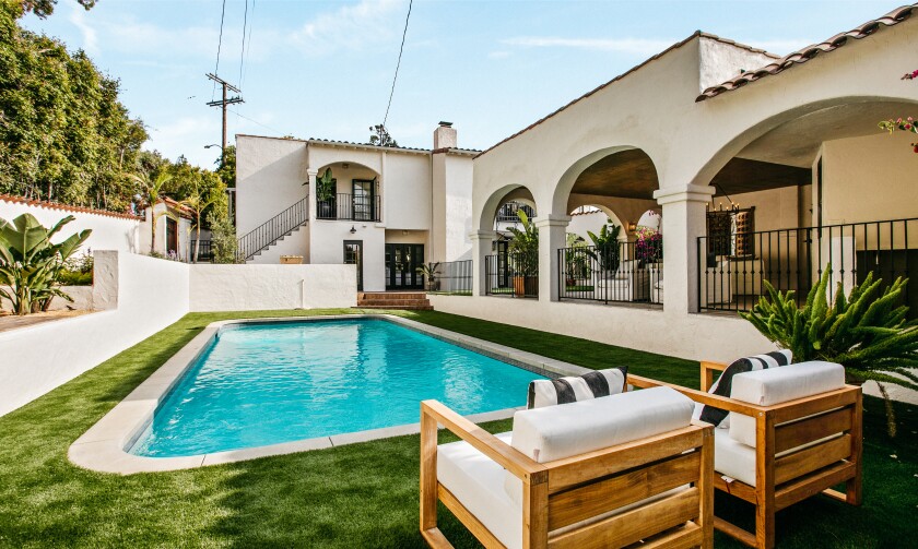 Built in 1931, the home formerly owned by Leonardo DiCaprio features a chic courtyard entry and a landscaped backyard with a swimming pool.