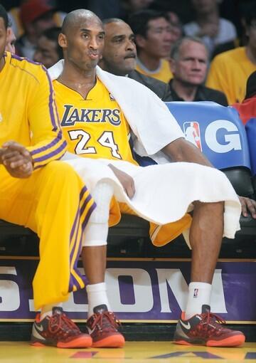 Lakers guard Kobe Bryant watches the final minutes of the 125-101 loss to the Clippers from the bench Thursday night at Staples Center.