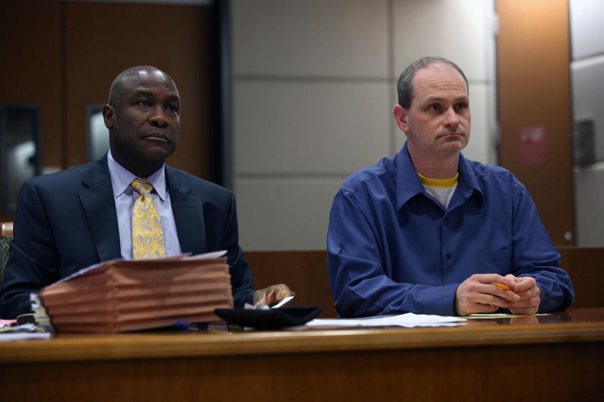 Nathan Louis Campbell, right, with attorney James Cooper III before closing arguments in Campbell's trial in May.