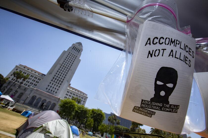 LOS ANGELES, CA - JULY 24: A group of people with the shared goal of promoting Black unity occupy an encampment in Grand Park on Friday, July 24, 2020 in Los Angeles, CA. (Brian van der Brug / Los Angeles Times)