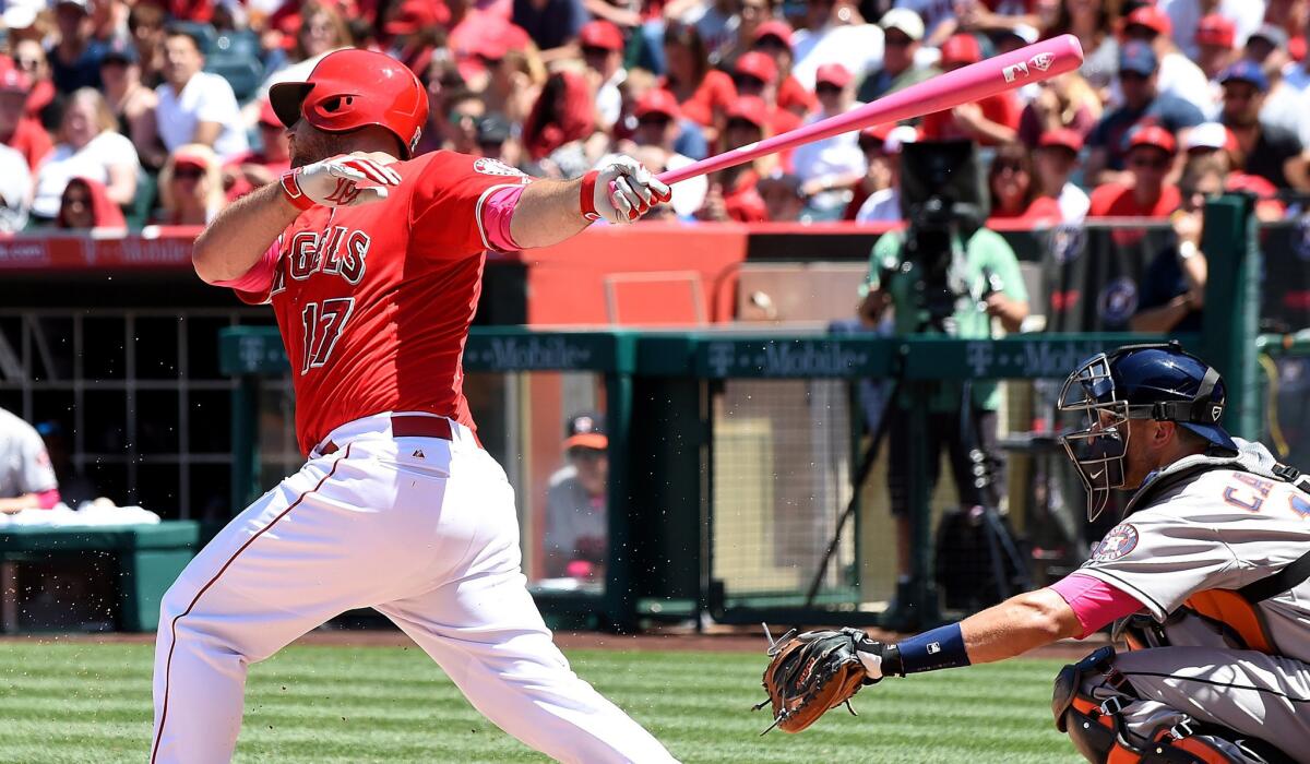 Angels catcher Chris Iannetta delivers a two-run single in the fifth inning against the Astros on Sunday in Anaheim.