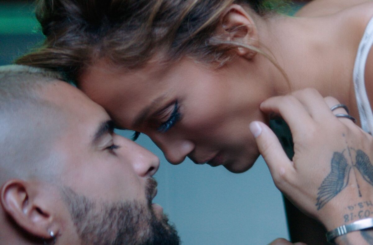 Maluma and Jennifer López in a scene from the video for "Lonely."