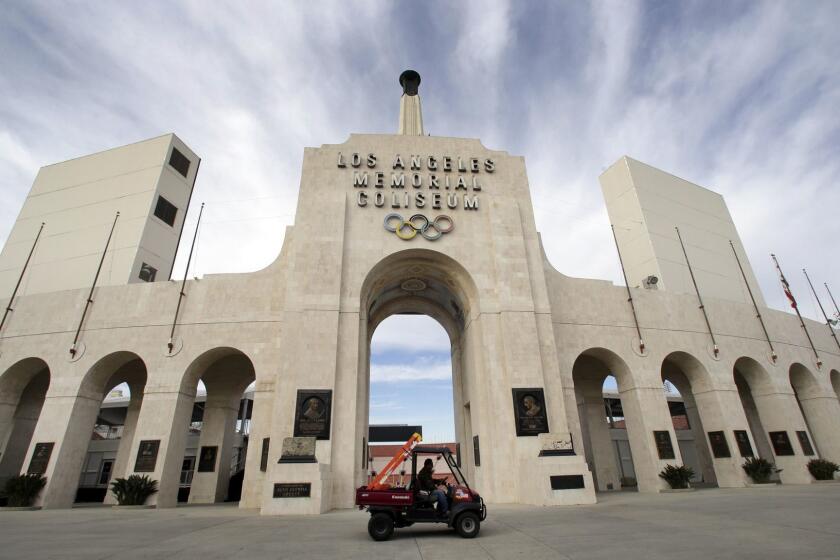 FILE - This Jan. 13, 2016 file photo shows the peristyle of the Los Angeles Memorial Coliseum in Los Angeles. The University of Southern California's sale of naming rights for Los Angeles Memorial Coliseum is being criticized as dishonoring the historic stadium's dedication as a memorial to soldiers who fought and died in World War I. USC announced last year that the stadium will be renamed United Airlines Memorial Coliseum as part of a $270 million renovation of the facility, which opened in 1923. (AP Photo/Nick Ut, File)