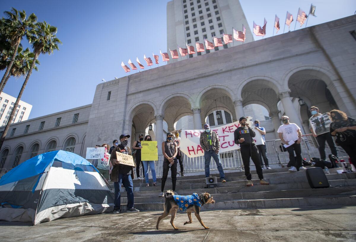 Activists outside L.A. City Hall protest a plan to remove homeless encampments.