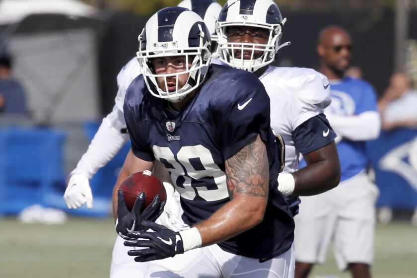 IRVINE, CALIFORNIA - JULY 30: Tyler Higbee #89 of the Los Angeles Rams carries the ball during training camp on July 30, 2019 in Irvine, California. (Photo by Josh Lefkowitz/Getty Images)