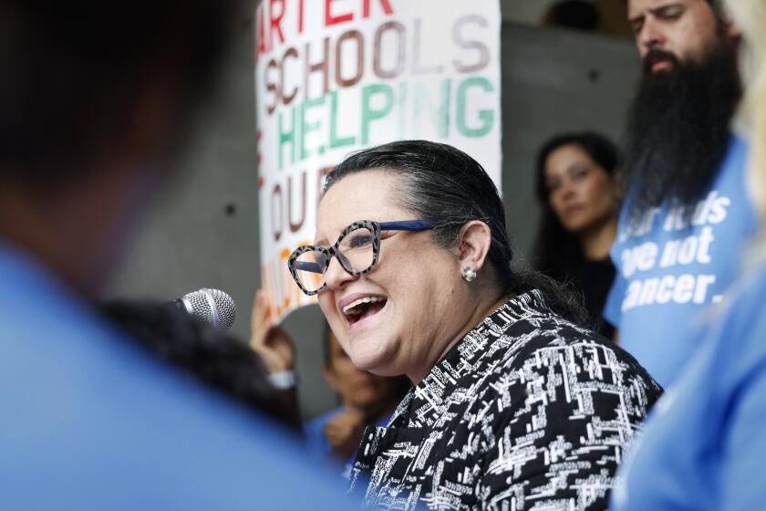LOS ANGELES-CA-SEPTEMBER 19, 2023: California Charter Schools Association President and CEO Myrna Castrejon, center, join parents, educators and supporters for a rally outside of Los Angeles Unified School District Headquarters in downtown Los Angeles on Tuesday, September 19, 2023. The rally takes place during a meeting of the Board of Education, where a resolution put forward by Los Angeles Unified School District Board President Jackie Goldberg and Member Rocio Rivas, will be discussed, which could make more than 200 district campuses ineligible to share space with charter public schools, a practice employed by the LAUSD commonly known as co-location. (Christina House / Los Angeles Times)