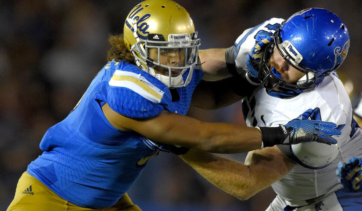 UCLA will be tested by the ground game of Arizona State on Thursday night. Above, Bruins linebacker Eric Kendricks tries to fend off a block by Memphis tight end Alan Cross in a game this month.