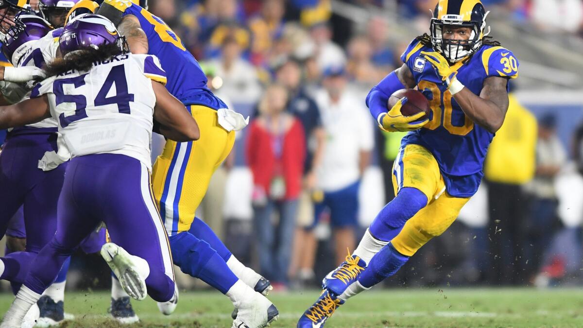 Rams running back Todd Gurley make a cut against the Minnesota Vikings defense to pick up yards in the third quarter at the Coliseum on Sept. 27.