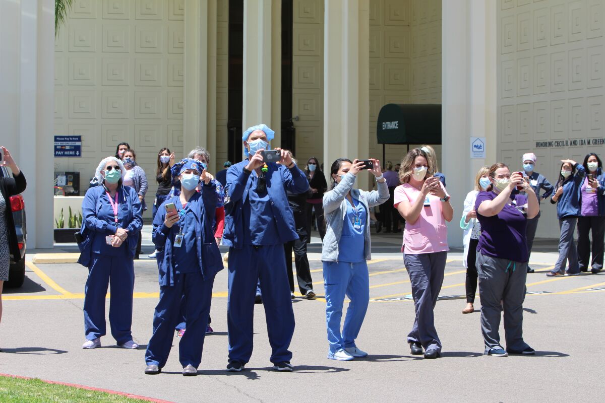 Staff members at Scripps Green Hospital watch and photograph a flyover by Air Force Thunderbirds on May 15.