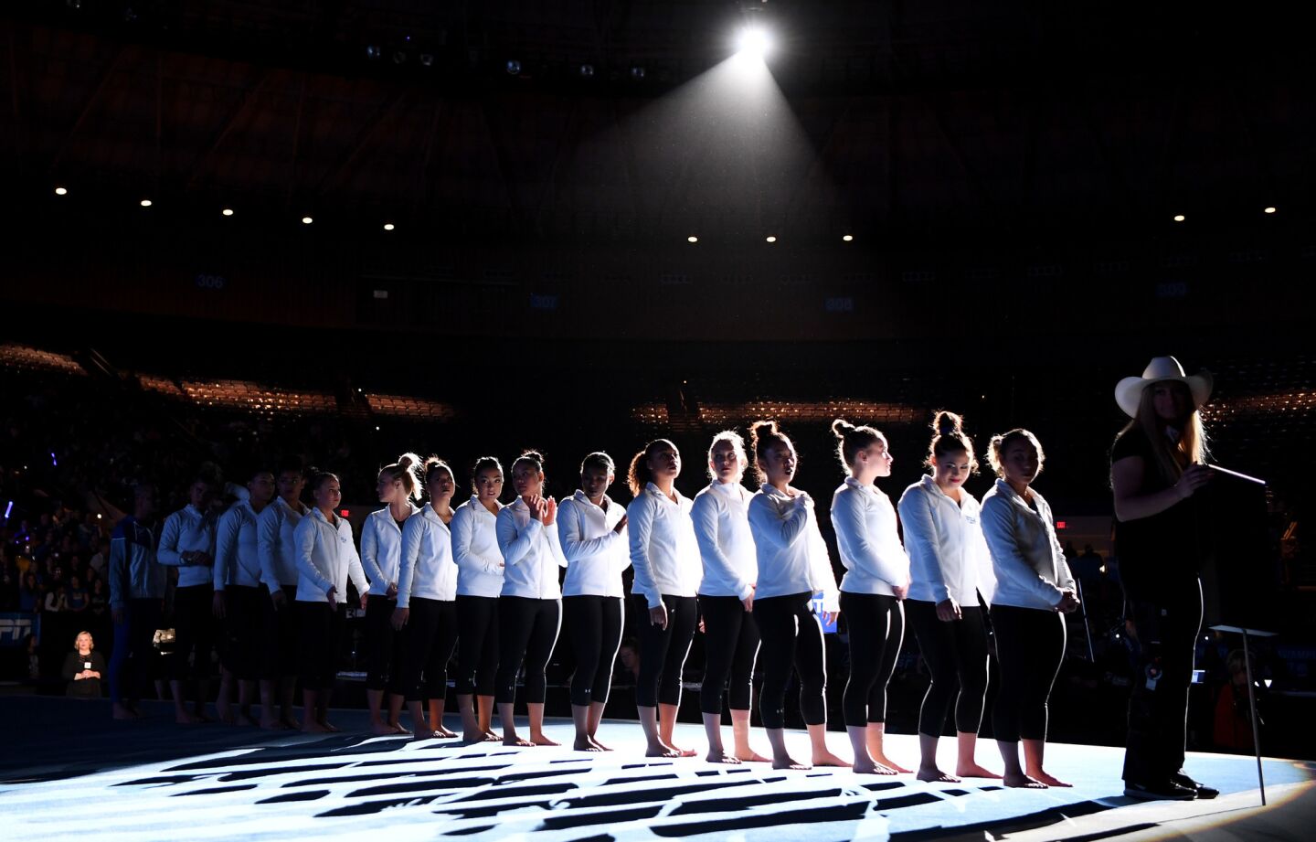 The UCLA gymnastics team is introduced before the NCAA semifinals at the Ft. Worth Convention Center.
