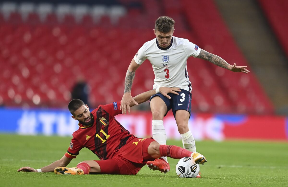 England's Kieran Trippier, right, is challenged by Belgium's Yannick Carrasco during the UEFA Nations League soccer match between England and Belgium at Wembley stadium in London, Sunday, Oct. 11, 2020. (Michael Regan/Pool via AP)