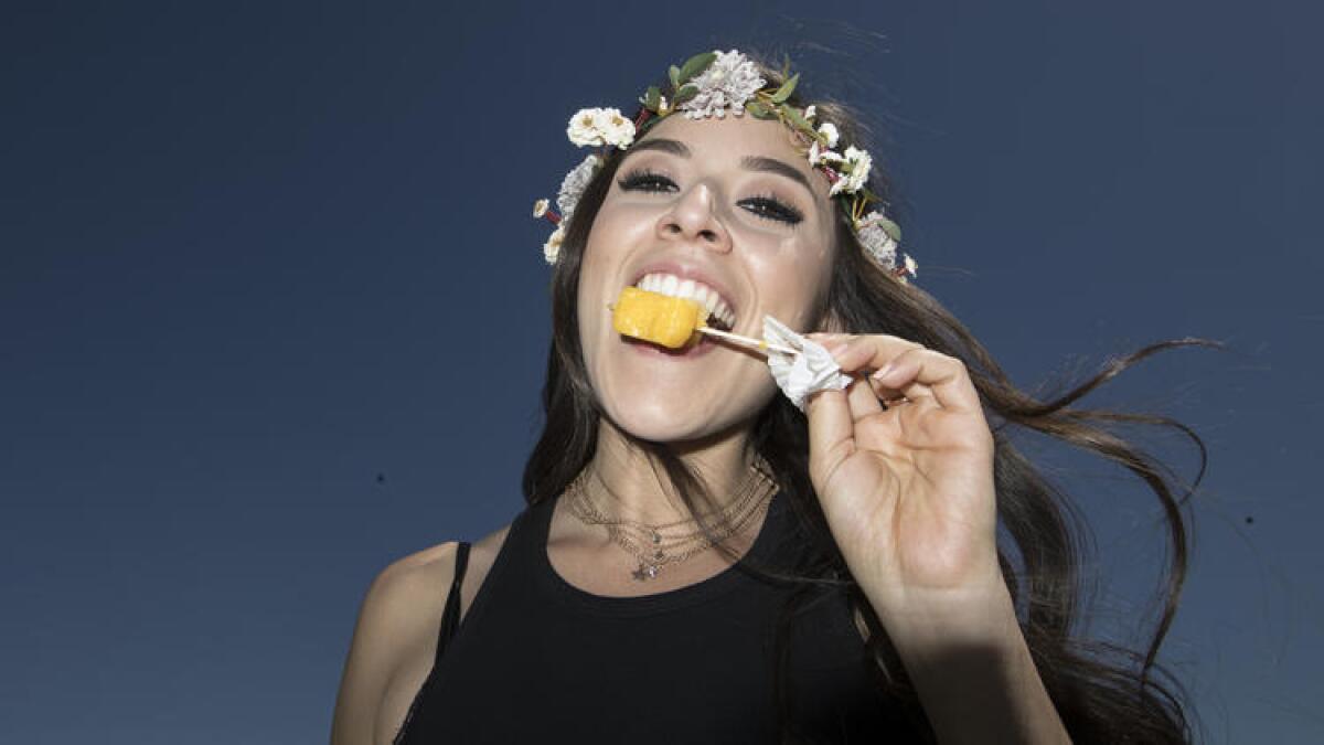 Gabriella Giogianni enjoys a frozen treat at the Coachella Music and Arts Festival.