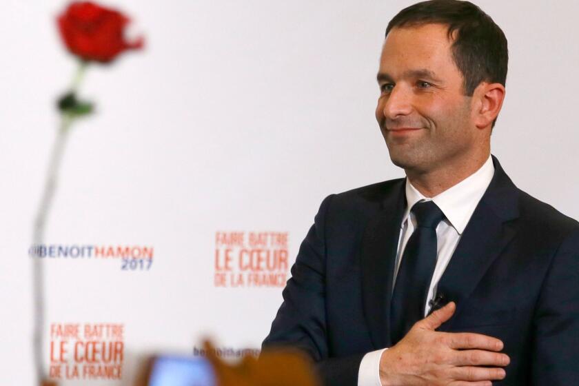 Benoit Hamon greets supporters after winning the Socialist Party presidential nomination in Paris on Sunday.
