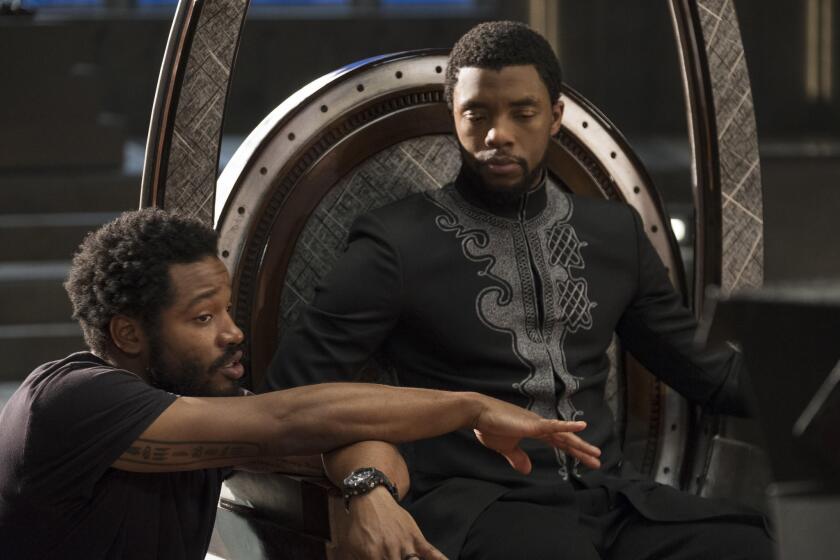 Marvel Studios' BLACK PANTHER..L to R: Director Ryan Coogler on set with Chadwick Boseman (Black Panther/T'Challa) ..Ph: Matt Kennedy..©Marvel Studios 2018