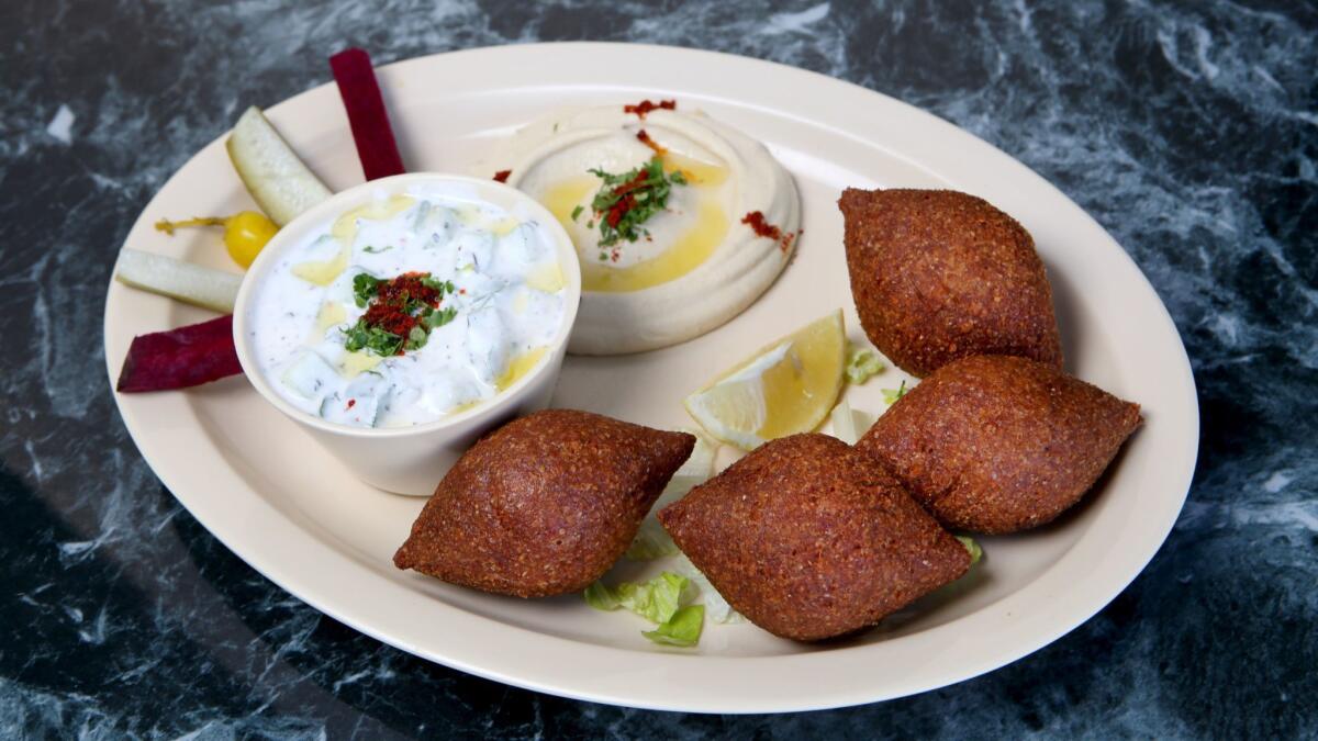 Fried kibbeh, hummus and yogurt with cucumber at Kobe Factory & Syrian Kitchen. The restaurant will offer a special dish each night of Ramadan.