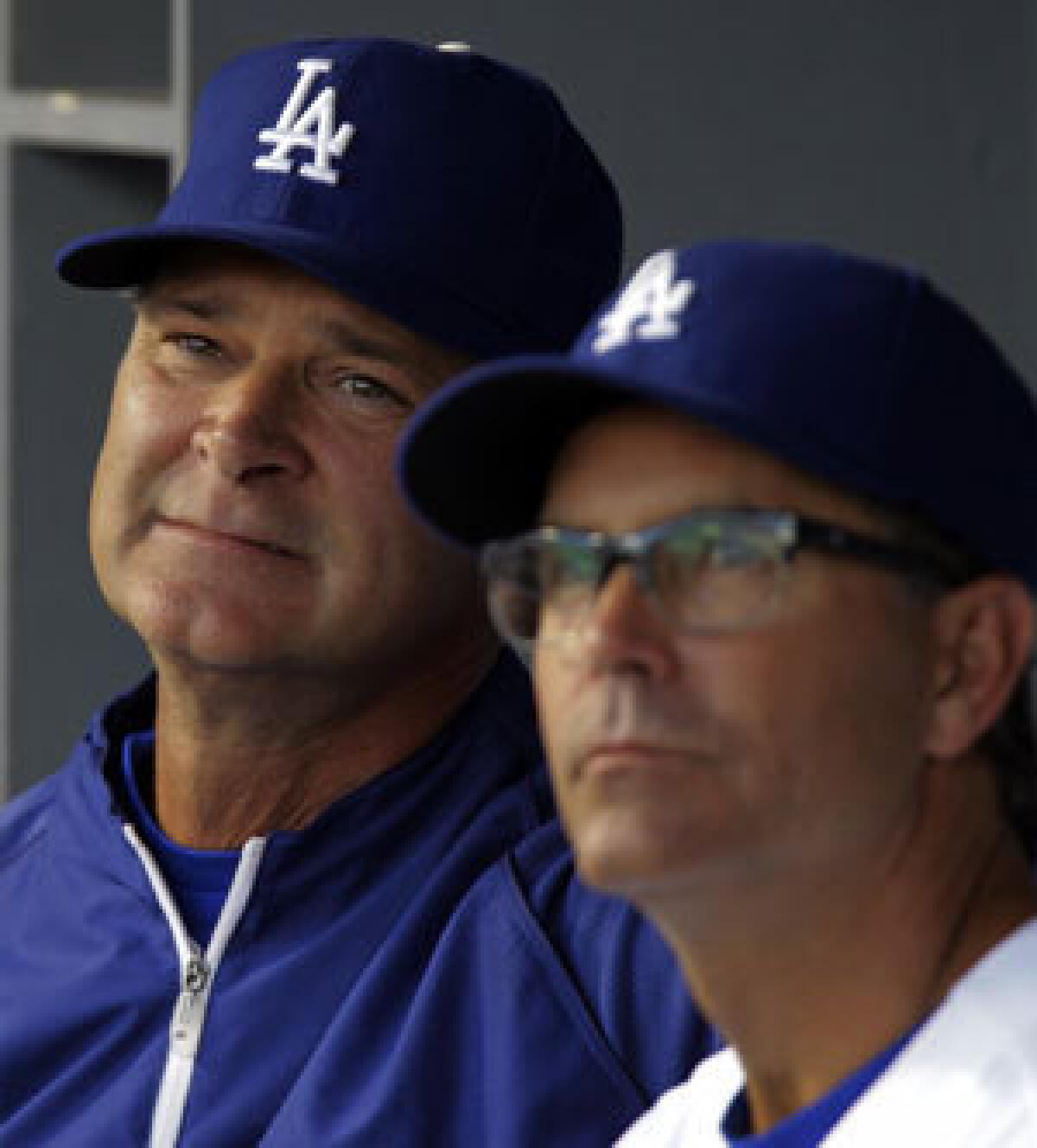 Don Mattingly, left, and Trey Hillman during a game in June.