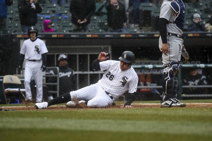 Avisail Garcia scores on an RBI double by Matt Davidson during the fifth inning of the White Sox home opener against the Detroit Tigers at Guaranteed Rate Field Thursday April, 5 2018, in Chicago.