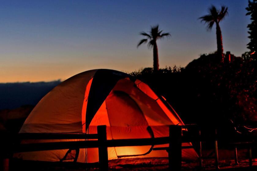 Jalama Beach County Park in Santa Barbara County: tent at the Jalama Beach County Park campground next to a camp fire at the end of a beautiful day.