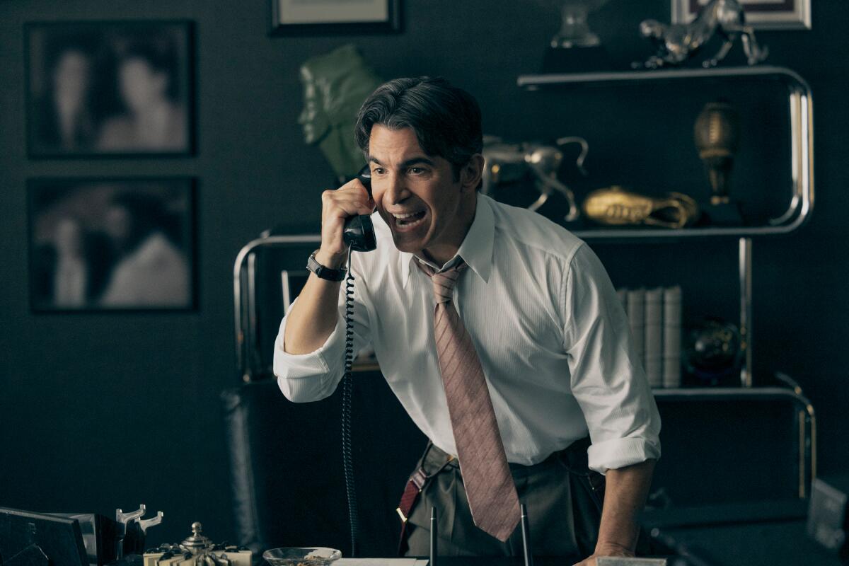 Chris Messina stands up from his desk chair and screams into a phone in a scene from ""Air."