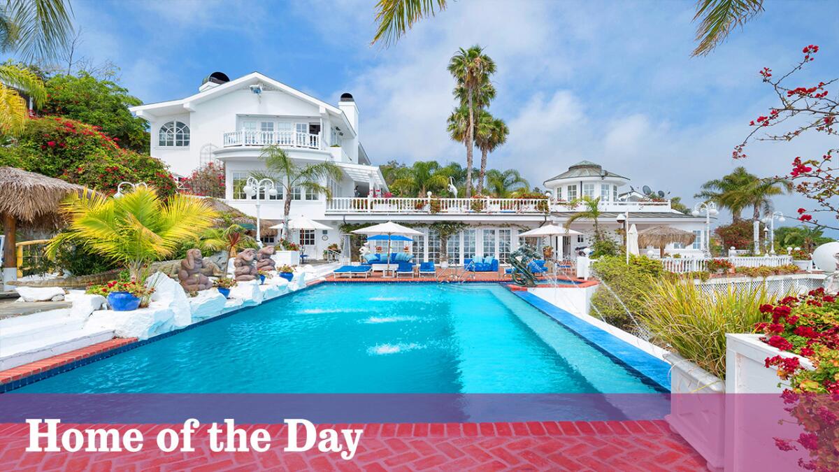 The roughly two-acre compound, listed for $24.495 million, sits behind a gated entrance on a hillside in Malibu.