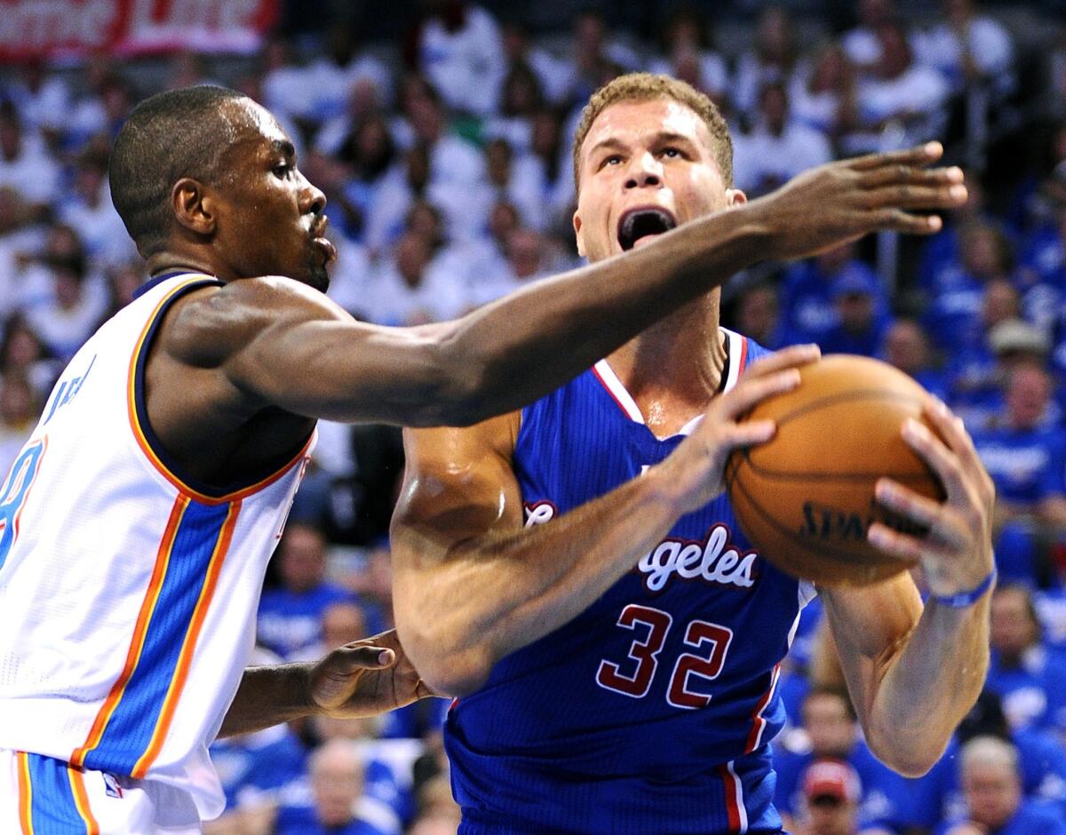 Thunder power forward Serge Ibaka forces Clippers power forward Blake Griffin into missing a shot in the first half of Game 2 on Wednesday night in Oklahoma City.