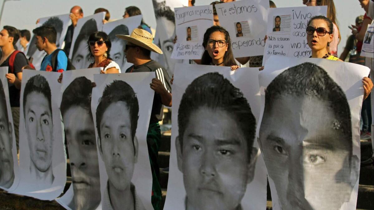 Relatives and friends of three missing students from the University of Audiovisual Media take part in a demonstration April 19 in Guadalajara demanding that their loved ones be returned alive. On Monday, authorities said the three had been killed, probably by a drug cartel.