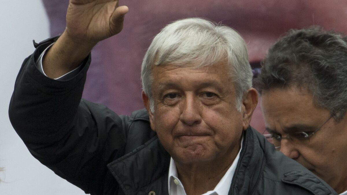 Presidential candidate Andres Manuel Lopez Obrador greets supporters during a campaign rally in Mexico City's Benito Juarez district on May 7, 2018. Mexico will elect a new president July 1.