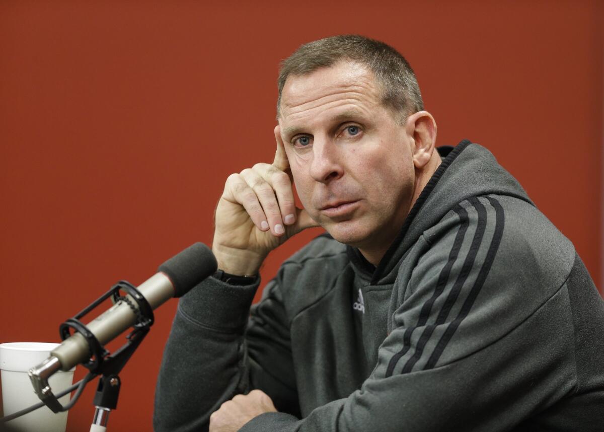 Bo Pelini participates in a Nebraska news conference on Nov. 24, six days before he was dismissed as head football coach by the university.