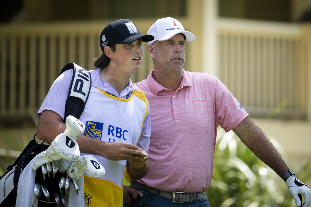 Stewart Cink, right, and his son and caddie, Reagan, look on during the final round of the RBC Heritage.