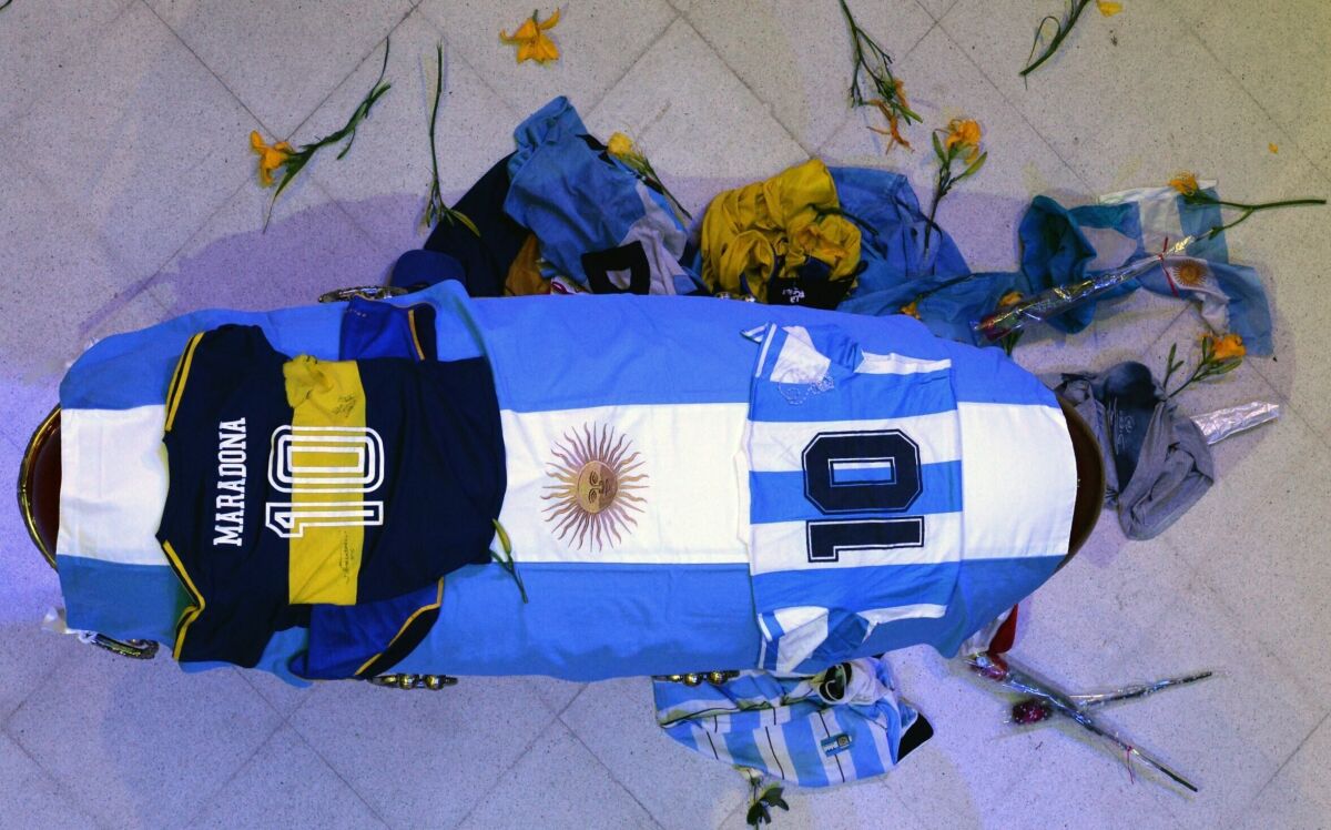 The coffin with the remains of Diego Maradona lies in state inside the presidential palace in Buenos Aires.