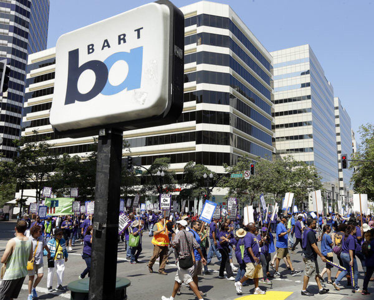 Striking Bay Area Rapid Transit workers picket in downtown Oakland on July 1. San Francisco Bay area commuters braced for the possibility of another train strike as BART and its workers approached a deadline to reach a new contract deal.