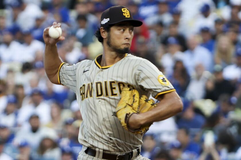 Los Angeles, CA - October 12: San Diego Padres starting pitcher Yu Darvish delivers a pitch.