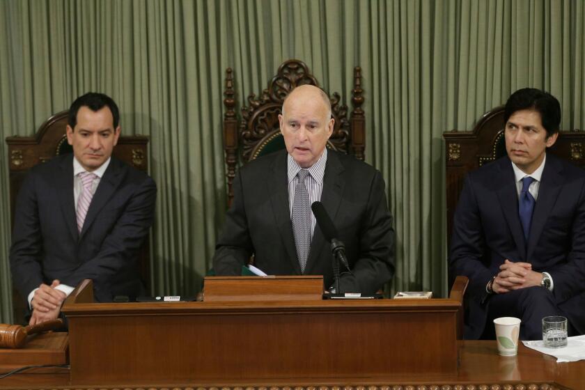 FILE - In this Jan. 24, 2017 file photo, California Gov. Jerry Brown delivers his annual State of the State address before a joint session of the California Legislature, in Sacramento, Calif. Brown will look back on his four terms as California's governor and lay out his vision for what's to come when he delivers his final State of the State address Thursday, Jan. 25, 2018. In the background are Assembly Speaker Anthony Rendon, D-Paramount, left, and Senate President Pro Tem Kevin de Leon, D-Los Angeles. (AP Photo/Rich Pedroncelli, File)