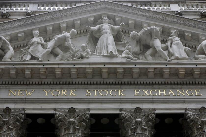 FILE - This Oct. 4, 2014, file photo, shows the facade of the New York Stock Exchange. Global markets meandered Thursday, Dec. 24, 2015, despite earlier gains in Asia and as the surge in oil prices faded in light Christmas Eve trading. (AP Photo/Richard Drew, File) ORG XMIT: NYBZ142
