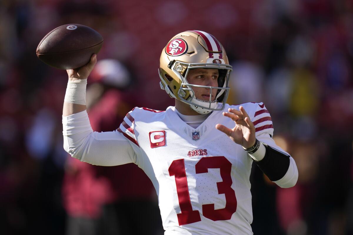 San Francisco 49ers quarterback Brock Purdy warms up before a game.